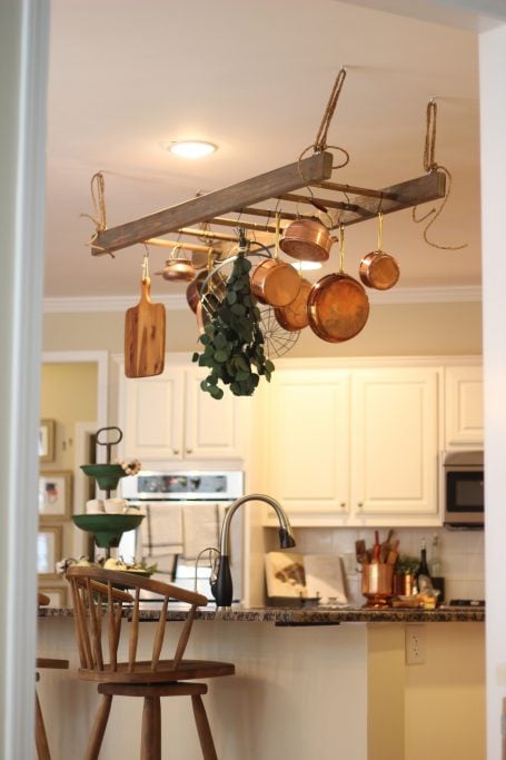 ladder as decor in kitchen for pots and pans