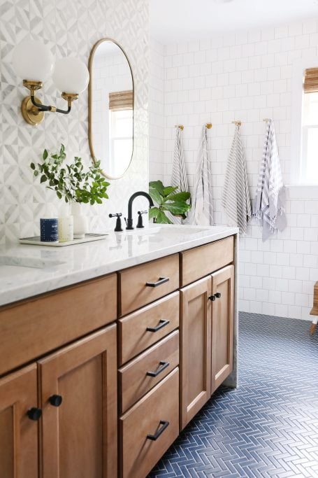 mixing matte black and gold hardware in a bathroom